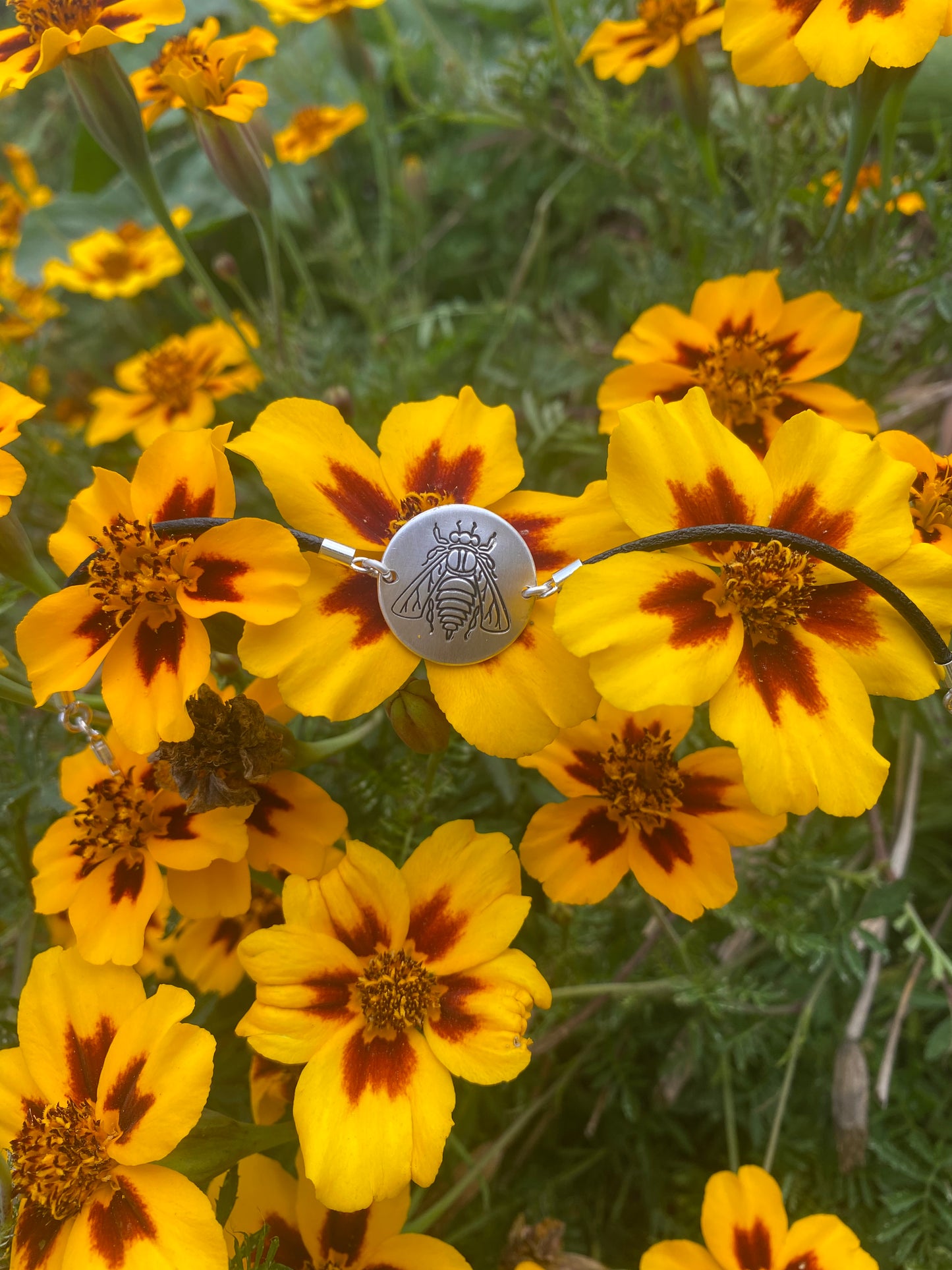 Permaterra silver medallion bracelet engraved with a bee