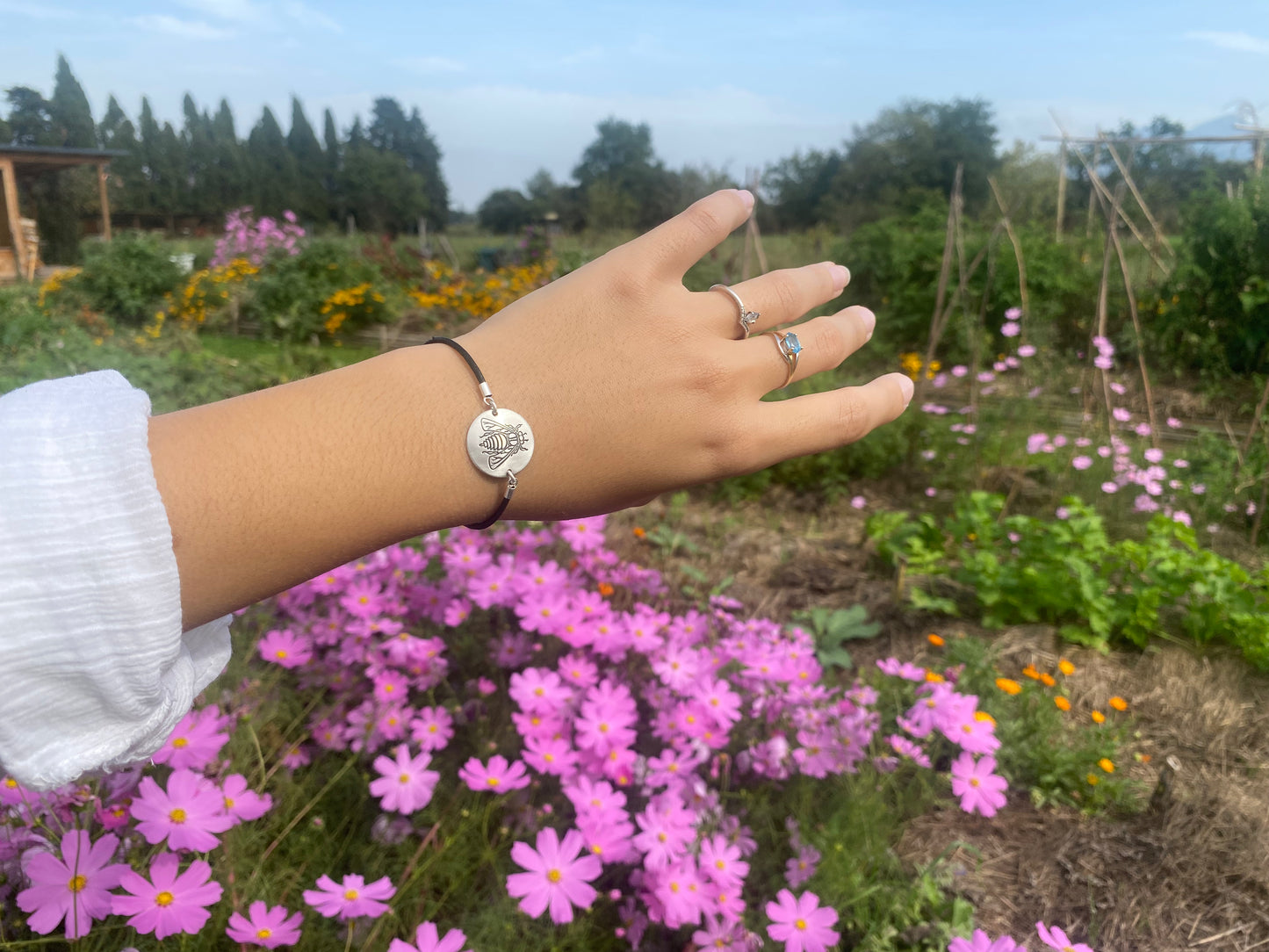 Permaterra silver medallion bracelet engraved with a bee